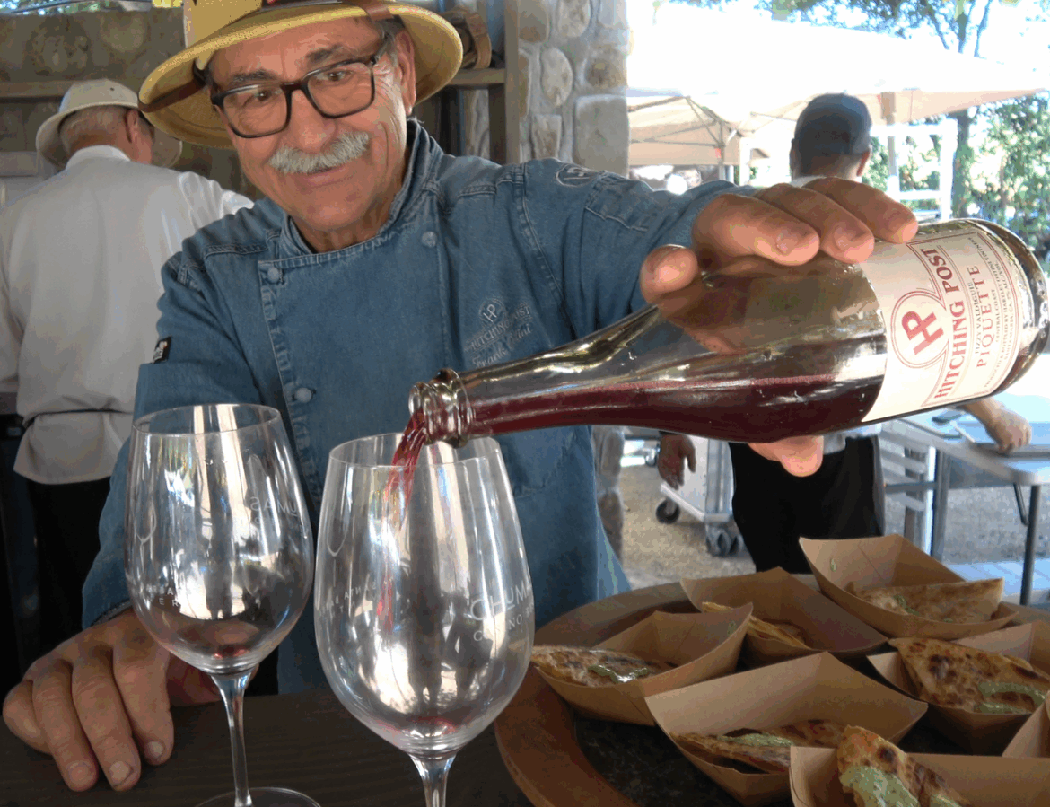 Frank Ostini pours wine at the 2025 Santa Barbara County Vintners Festival.