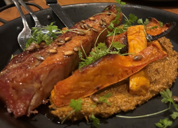 Roasted pork belly with a delectable glaze of Balsamic Vinegar of Modena PGI offers both acidic sharpness and a balance of sweetness to complement the richness of the succulent meat strip. For an autumnal flavor profile, the pork belly can be paired and plated with roasted fall squash and ground pumpkin seeds. (Philip Potempa/for Post-Tribune)