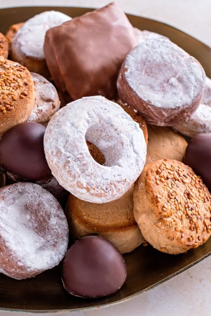 Top 10 Spanish Christmas desserts. Photo shows Polvorones, Mantecados, and Spanish Christmas cookies on a plate.