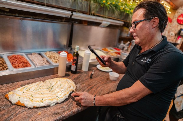 Owner Alfi Picone films close up shots of a German...