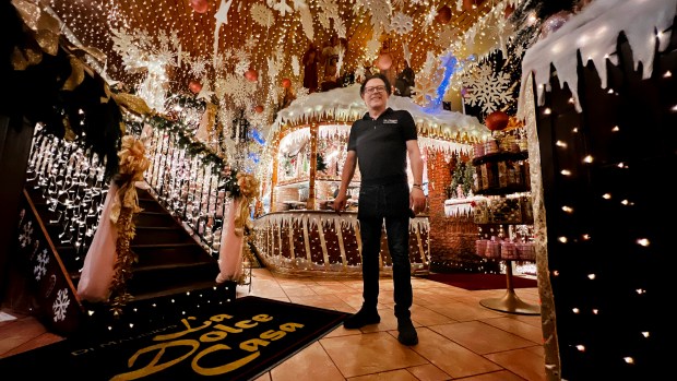 Owner Alfonse "Alfi" Picone, shown last holiday season, invests in decorating his restaurant in the spirit of Christmas and positivity. This year, he's putting more lights than ever inside and outside his restaurant, creating a Rockefeller Center theme. (JOHNATHAN B. PAROBY/CONTRIBUTING PHOTOGRAPHER)