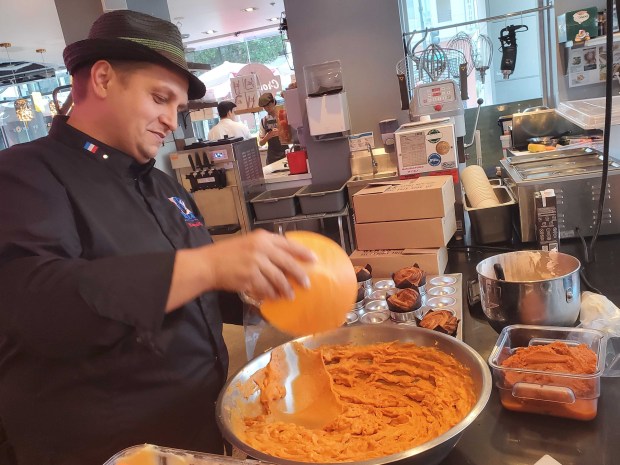 Award-winning chef Romuald Guiot, 48, works on cruffins, or muffin...