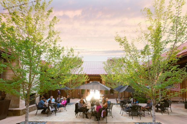 At Oak Farm Vineyards, small tables and larger communal picnic benches set the scene for an evening of rest, relaxation and community. (Courtesy of Oak Farm Vineyards)