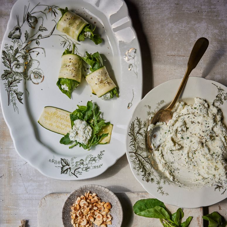 Squash rolls being assembled with herb and ricotta filling.