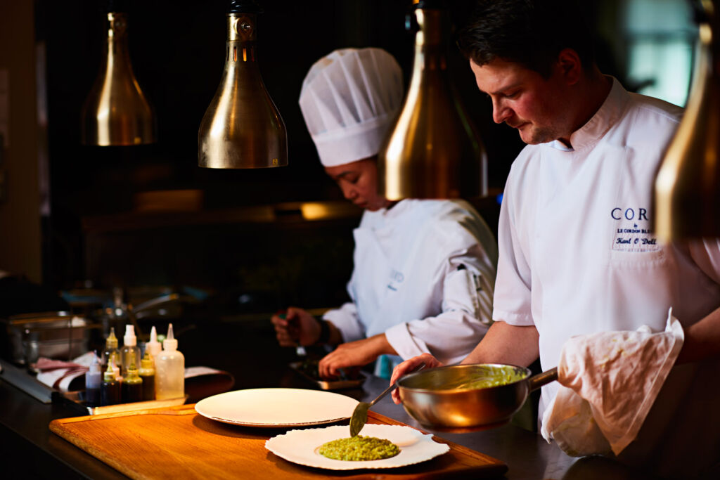 The chef and his team working in the kitchen