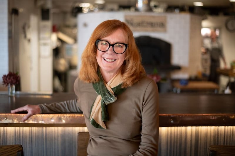 Cathy Whims at her beloved Southeast Portland restaurant, Nostrana, which marks its 20th anniversary this month.