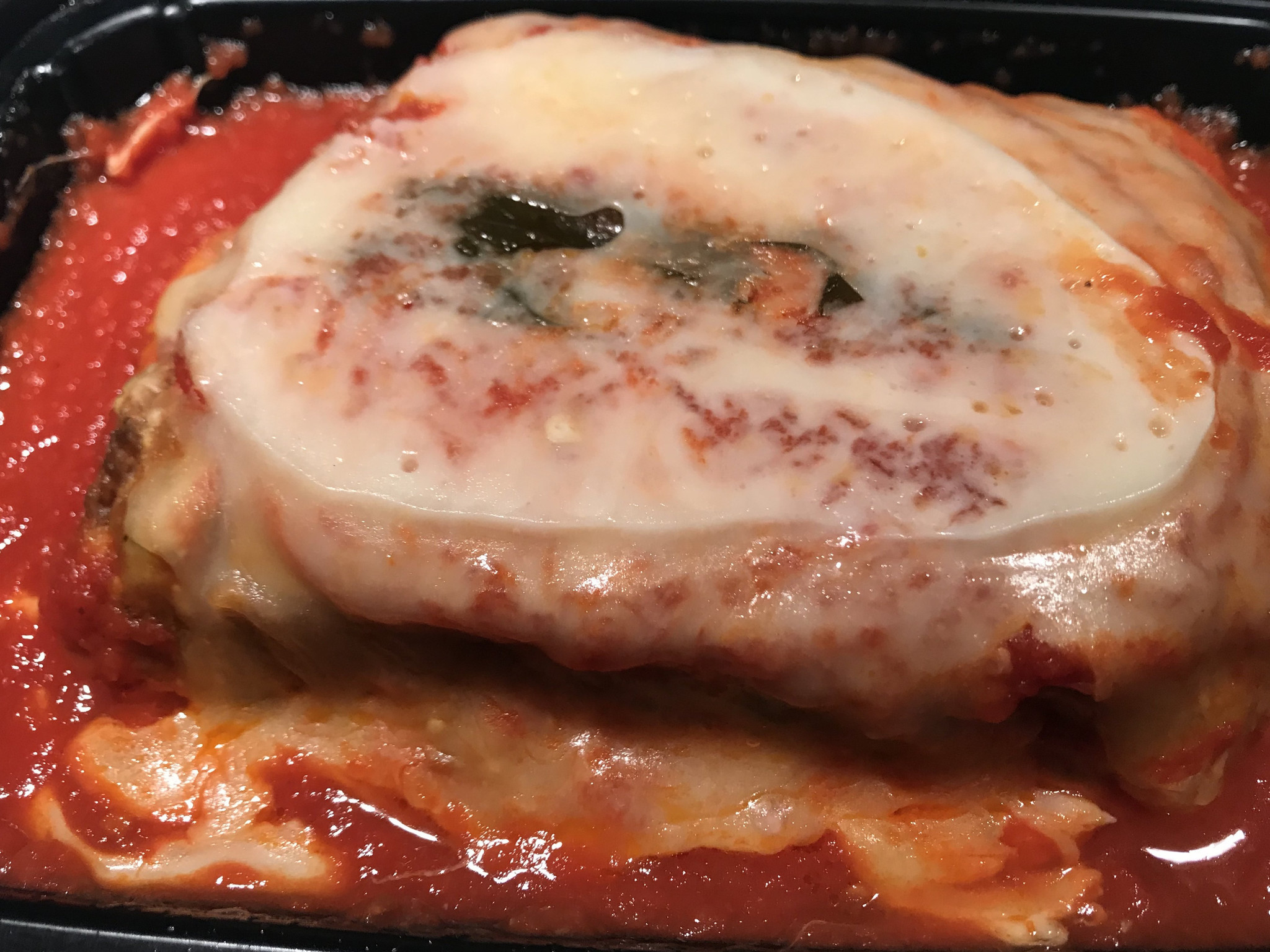 Rosebud's lasagna gets a little smooshed in the takeout container, but the formidable serving delivers rich flavor. Rosebud's lasagna gets a little smooshed in the takeout container, but the formidable serving delivers rich flavor.