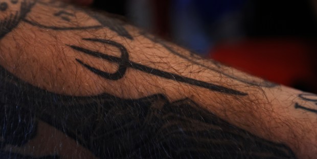 Chef Bradley Wildridge, has a tattoo of Hell’s Kitchen pitchfork,...