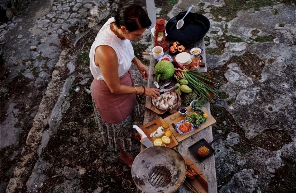 Michelle Rousseau preparing ingredients for outdoor cooking