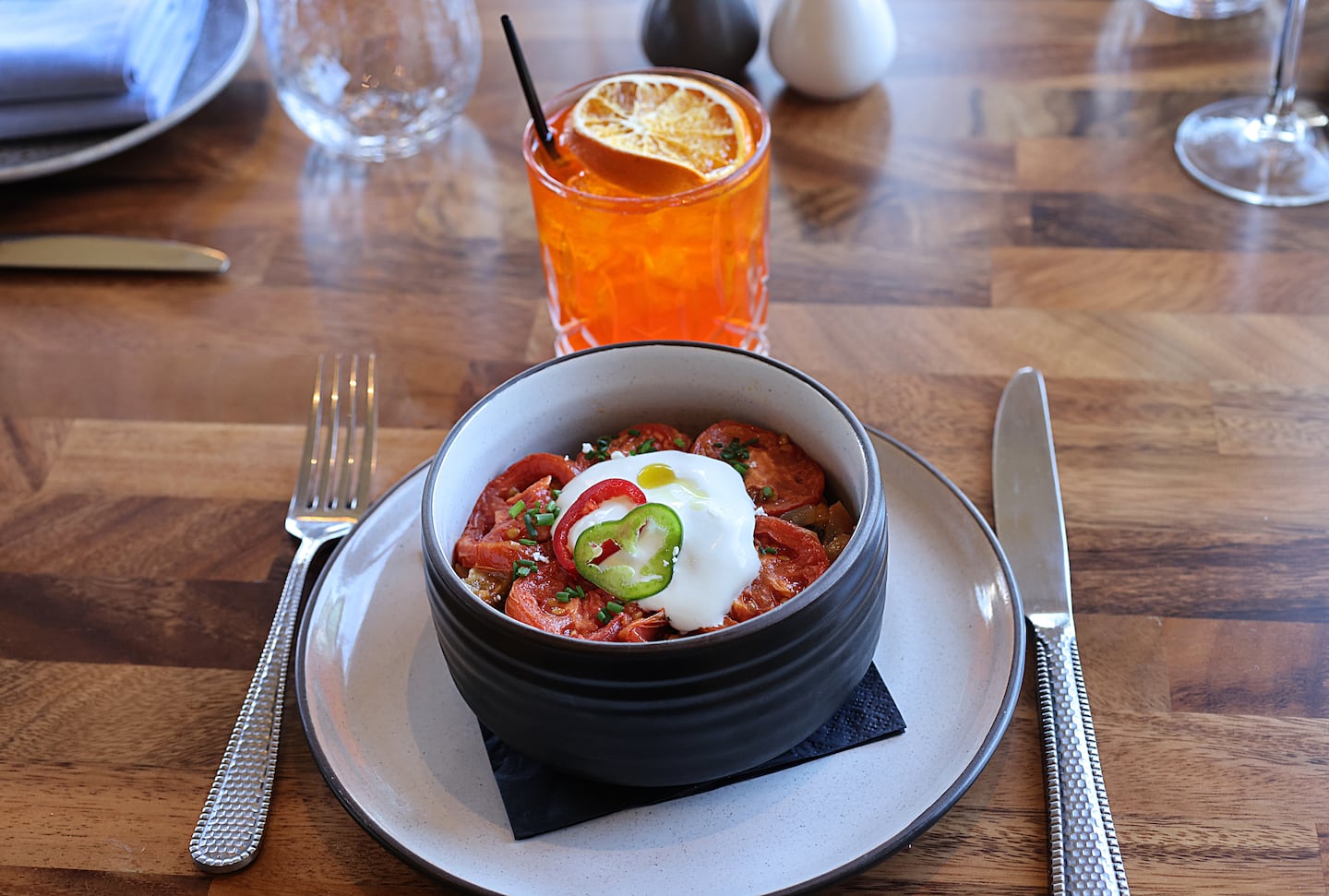 A fine roasted vegetable dish called briam, in which potatoes, eggplant, zucchini, tomatoes, and feta are layered and baked.