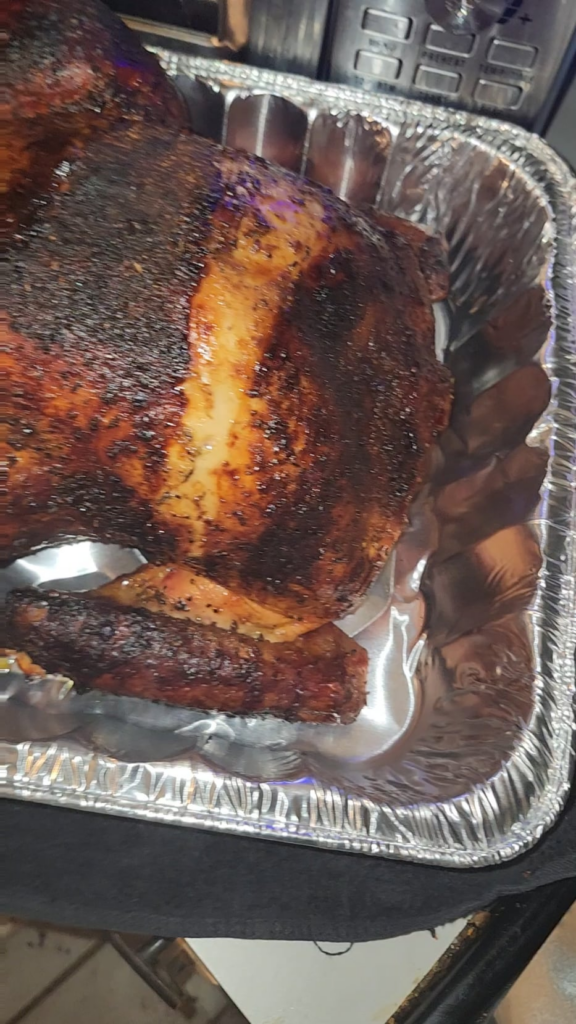 charcoal rotisserie turkey and pork loin done