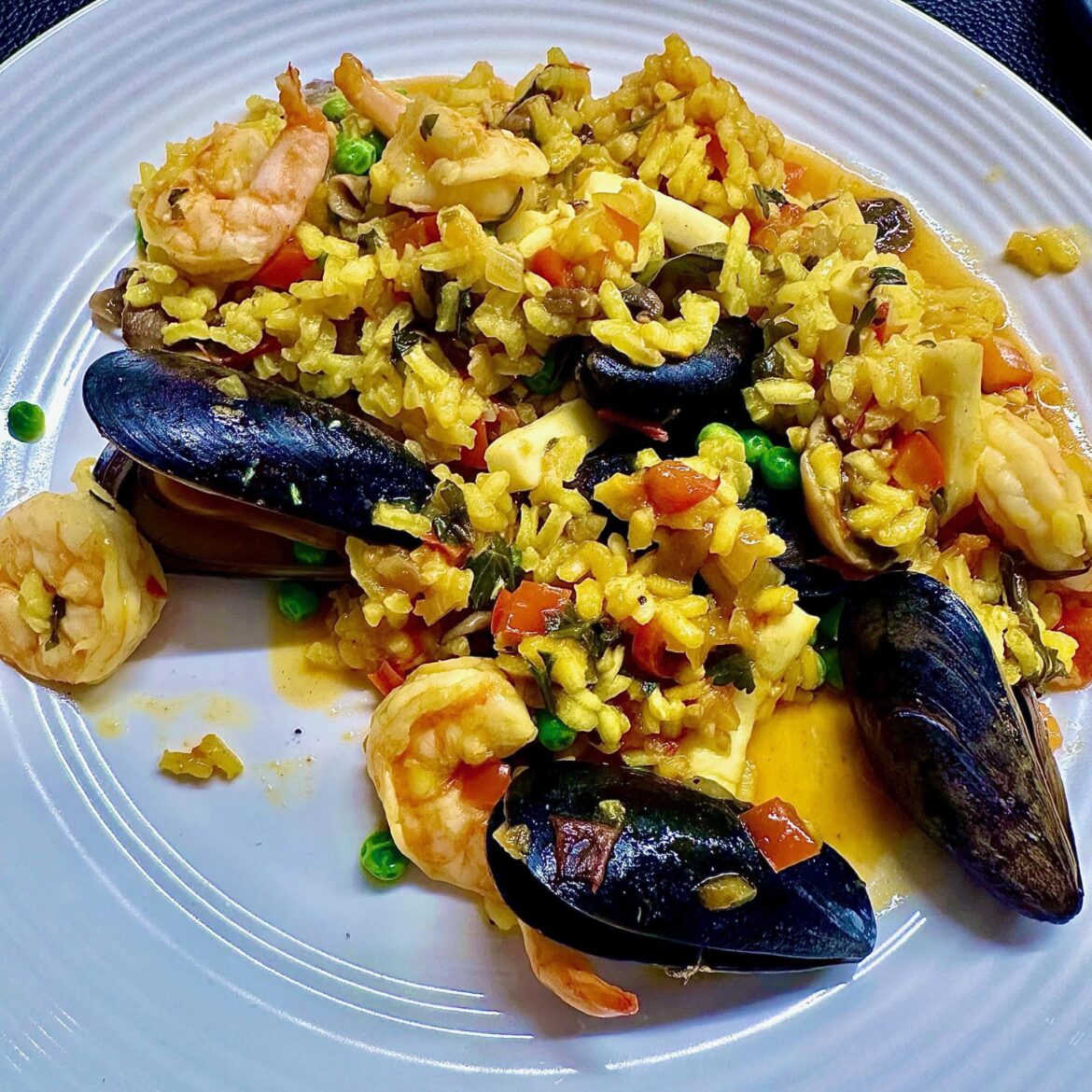 [Homemade] Tried making seafood paella for the first time — any tips for getting the rice perfect?