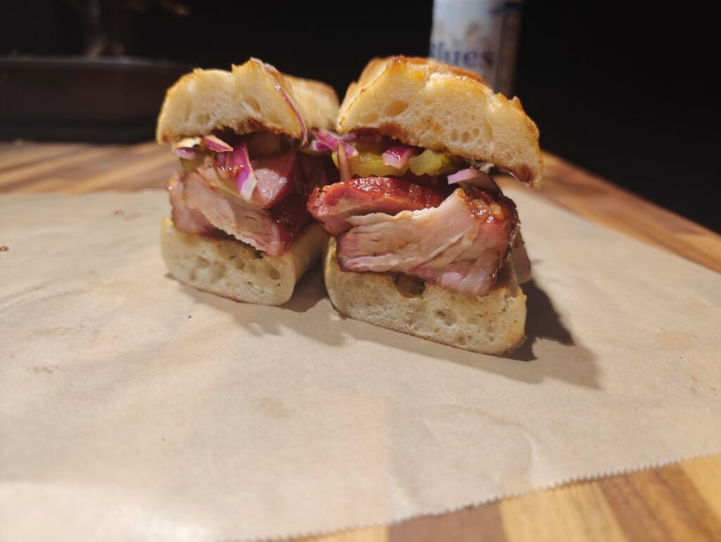 Smoked country style rib sandwich with some grilled corn on the cob