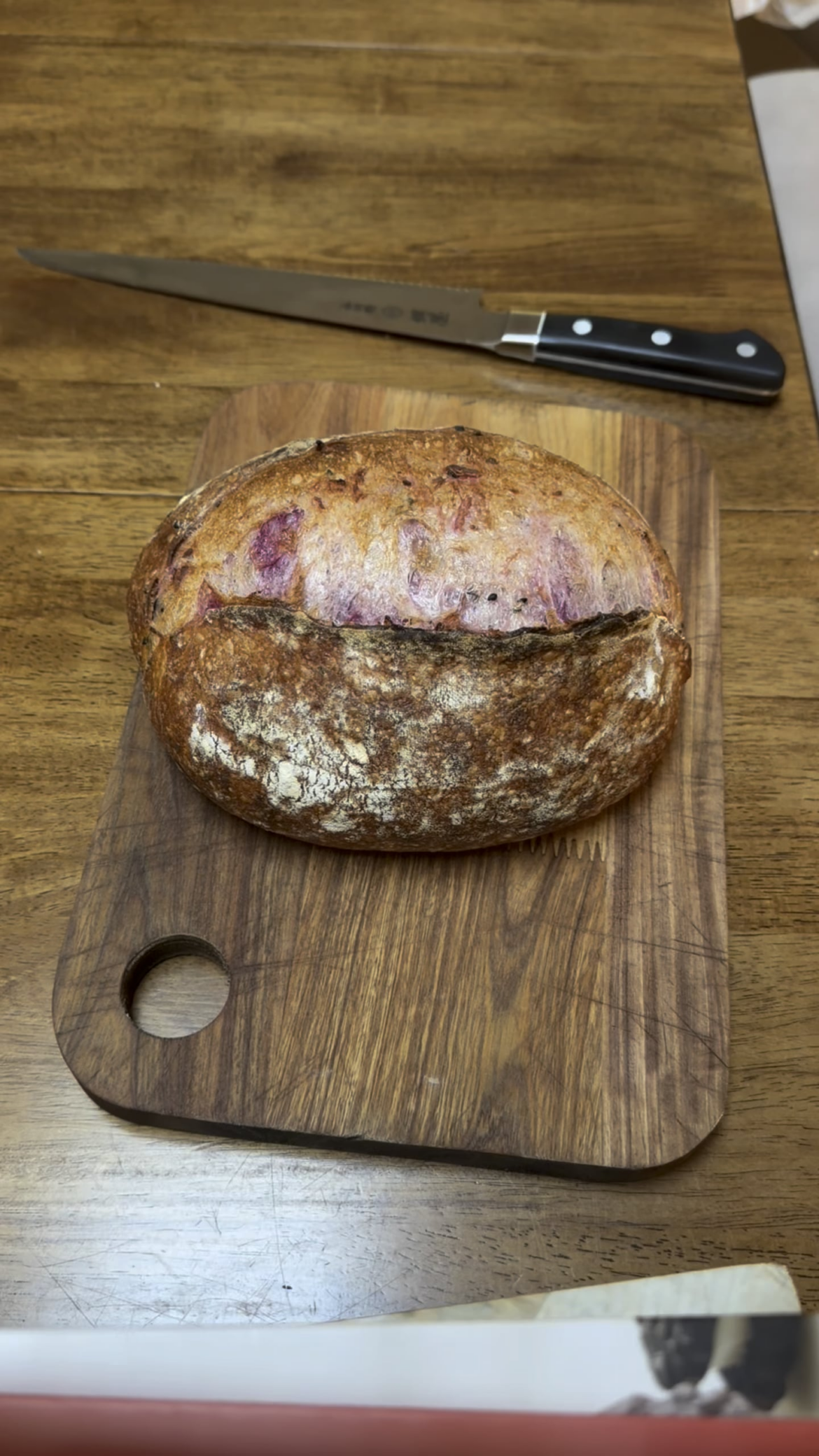 Crumb reveal of purple sweet potato and black sesame sourdough