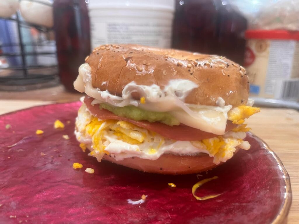 Duck eggs, cream cheese, mozzarella, bologna, mustard, avocado breakfast sandwich