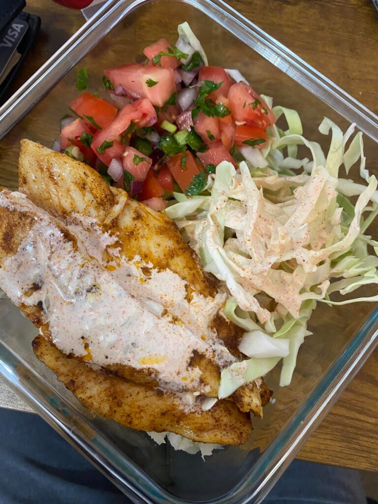 Fish/Shrimp Taco Bowl wIth pico de gallo, slaw, cilantro-like cauliflower rice and chipotle sauce. ~500 cal