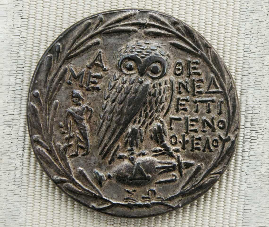 Athenian silver tetradrachm (ca. 200–150 B.C.) showing an owl and olive wreath, symbols of Athens’ wealth and olive oil trade