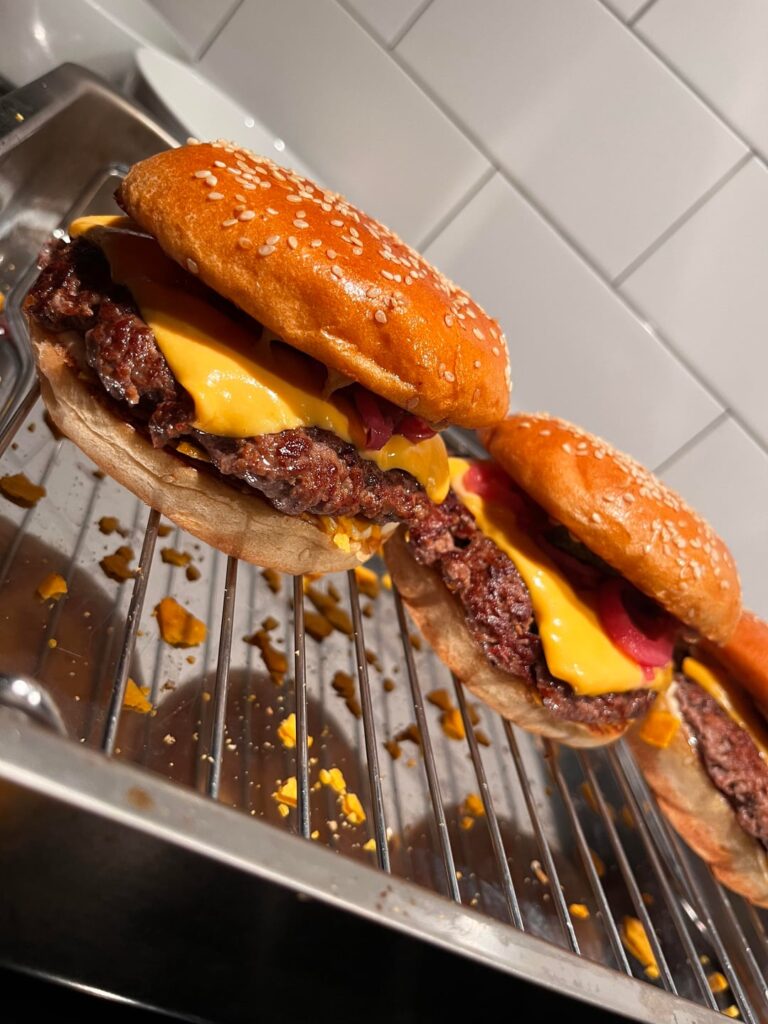 [homemade] Cheeseburgers with pickles, red onions and crushed nachos