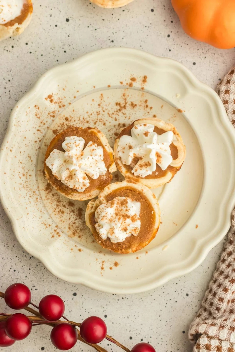 Mini pumpkin pies on a plate.