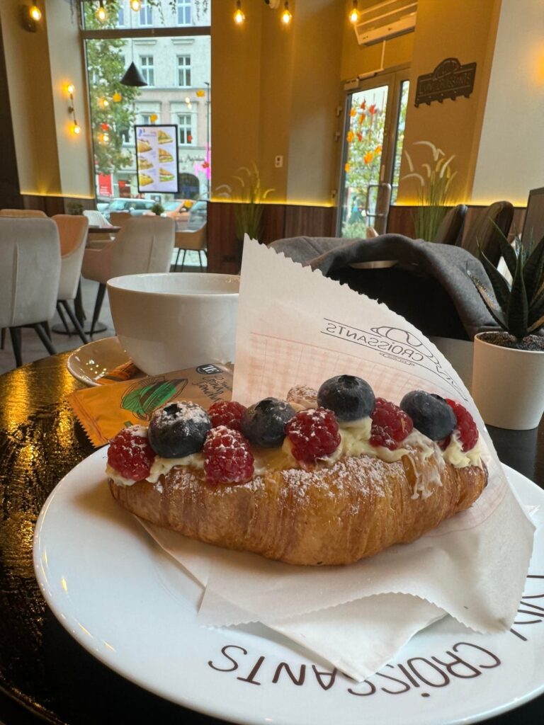 A breakfast that feels like a hug — croissant, fruit, whipped cream, and tea filling the air with magic🍂💛