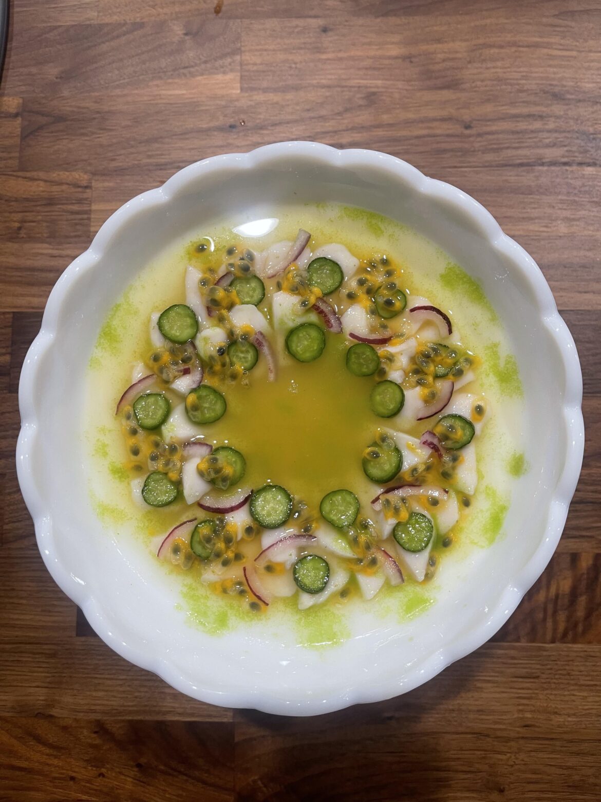 Scallop ceviche with passion fruit, red onion, cucumber and jalapeño cilantro oil