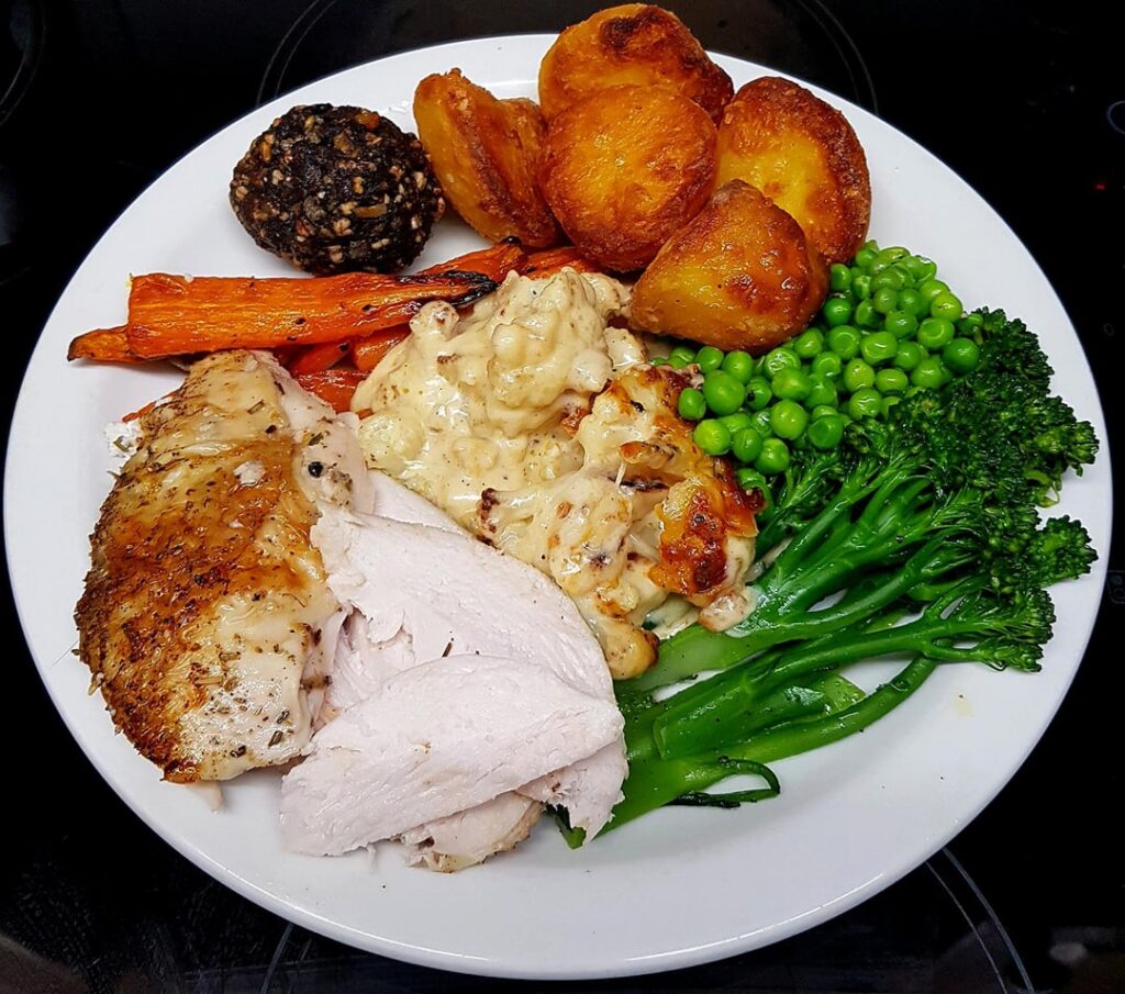 Sunday Roast - Tarragon Butter Stuffed Chicken Crown, Roast Potatoes, Carrots, Peas, Brocolli, Cauli Cheese, Sage, Onion, B.Pudding Stuffing and Pan Gravy.