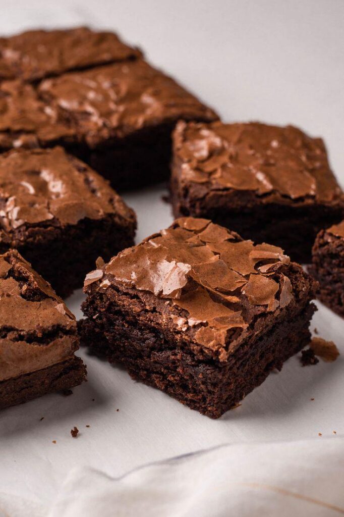 [Homemade] Fudgy chocolate brownies with a glossy, crinkle top and rich, gooey center