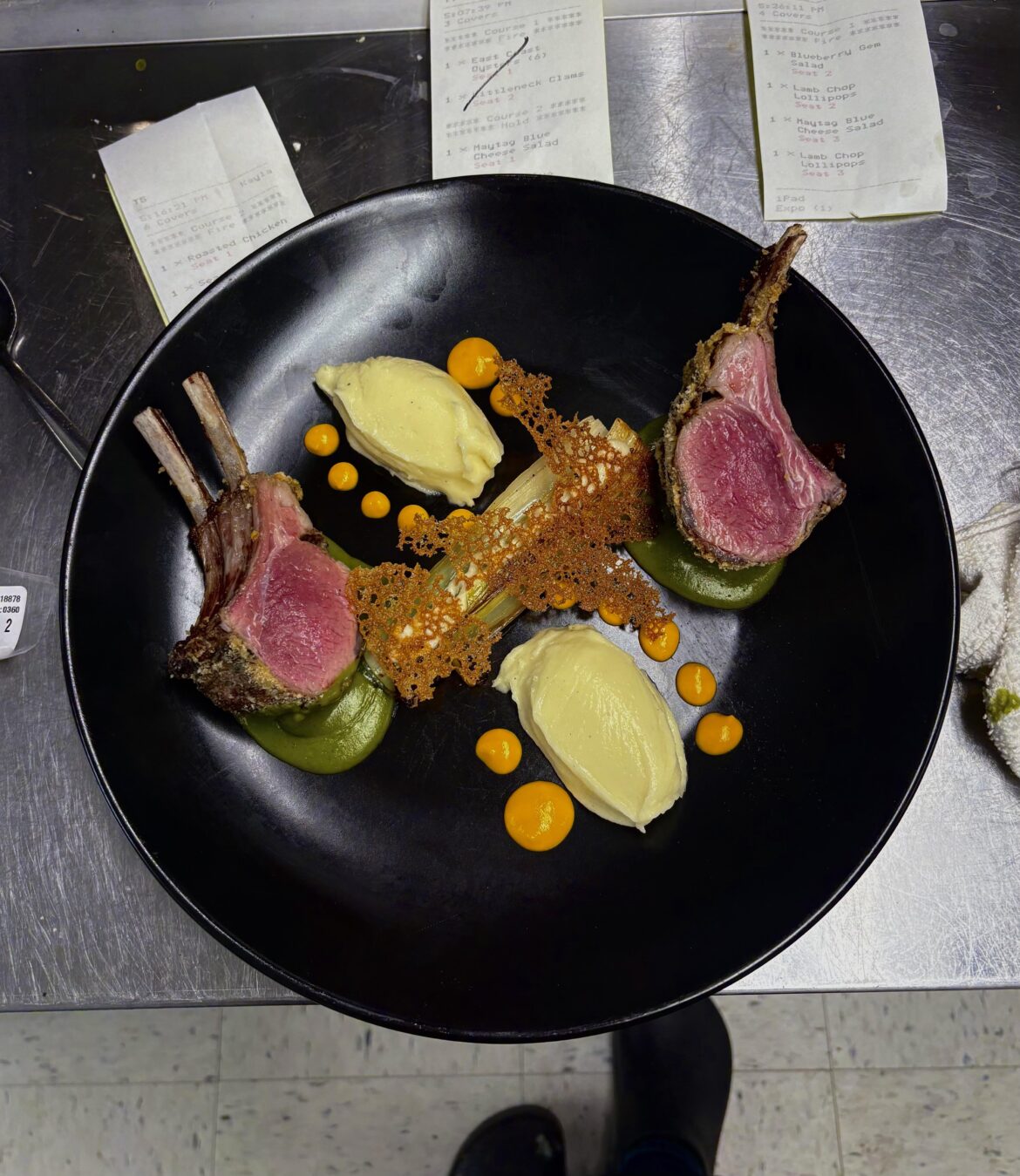 Herb/Panko crusted rack of lamb, pommes puree, carrot emulsion, braised leek, onion cream and tuile, herb veloute
