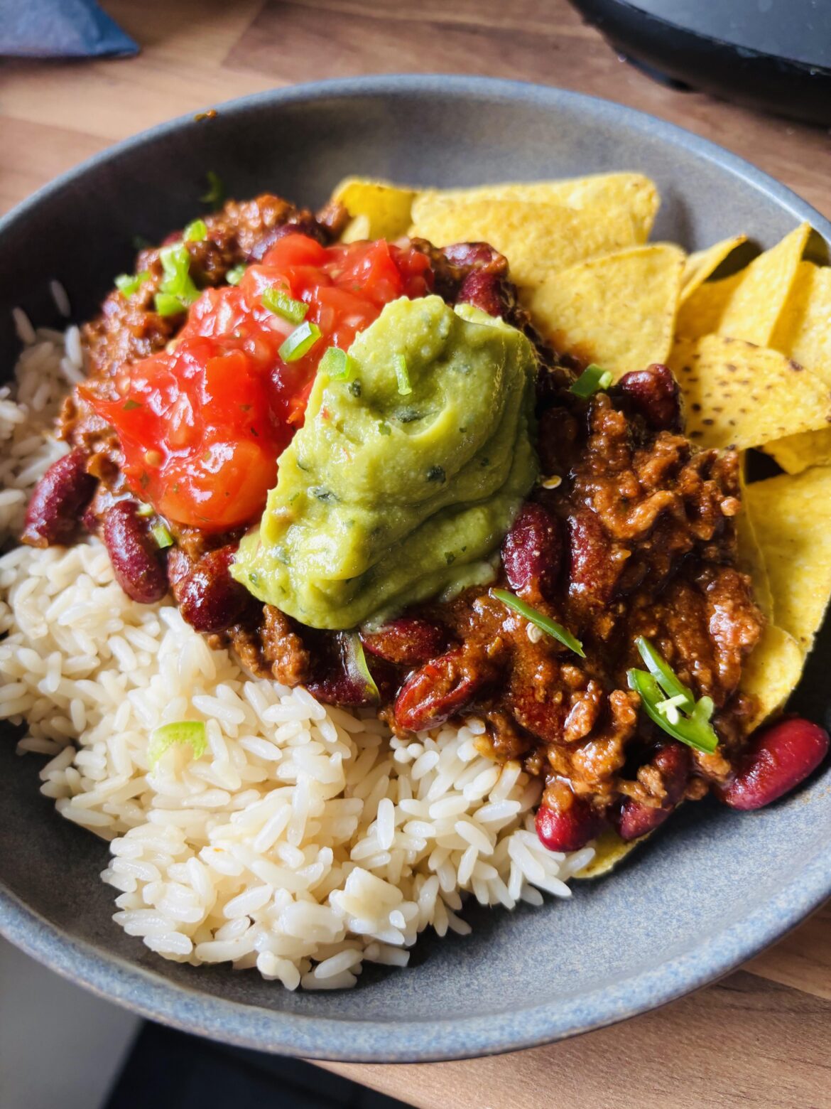 Chilli con Carne with half and half Rice and Nachos.