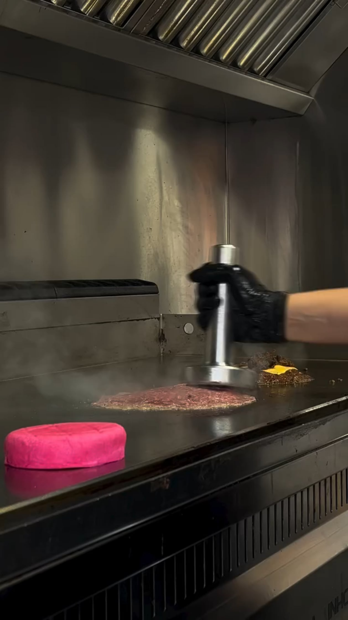 A bunch of slop between a pink burger bun...yes pink