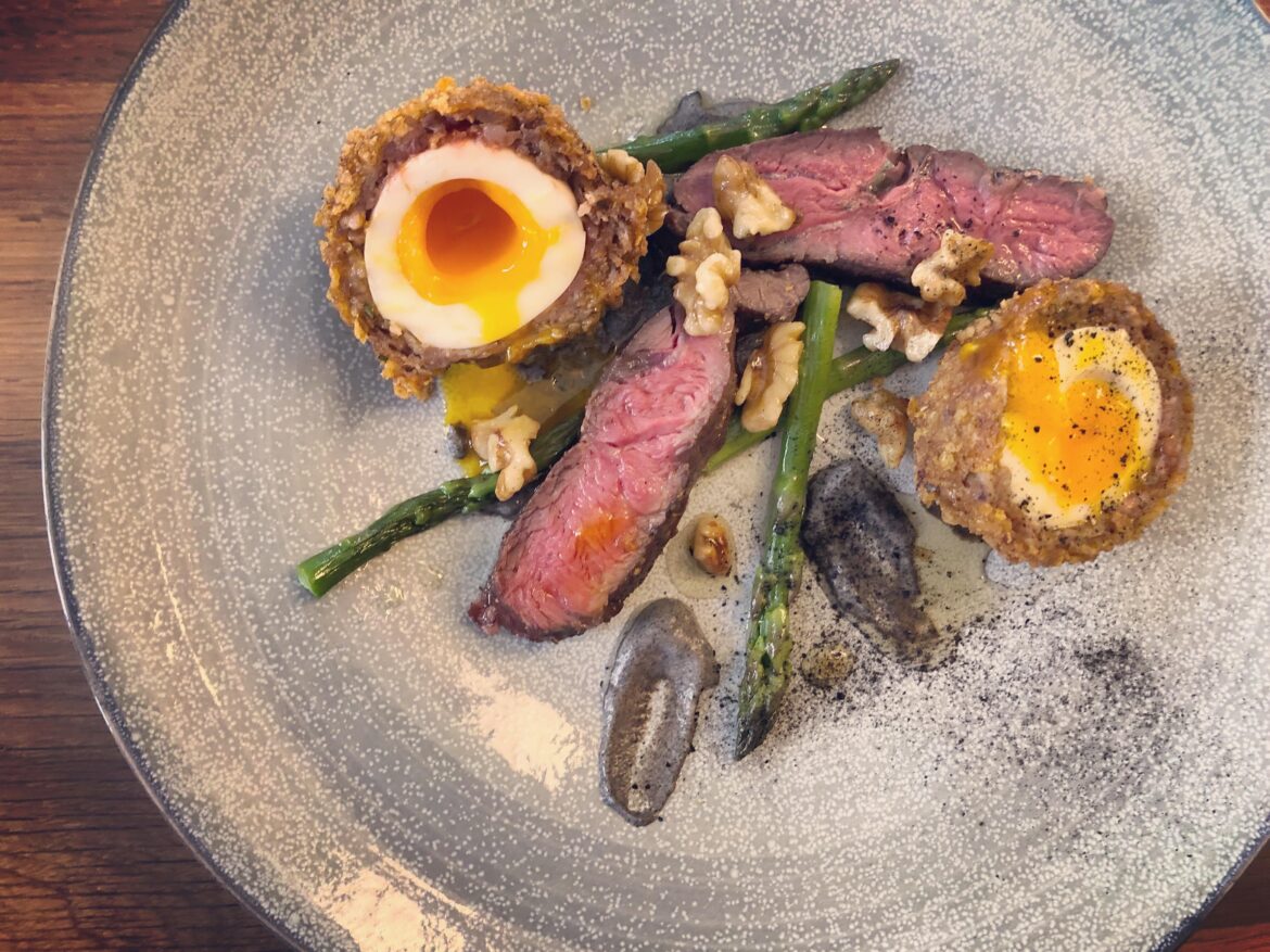 Scotch eggs, hangar steak, toasted walnuts,asparagus, onion ash, maple gastric