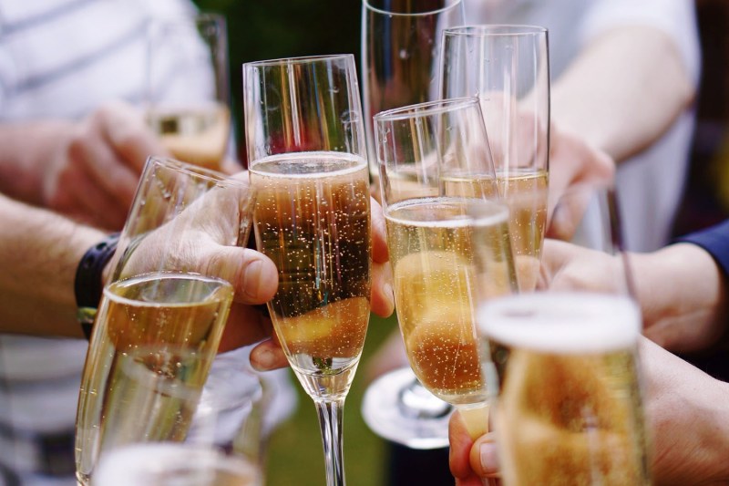 A toast with several glasses of sparkling wine