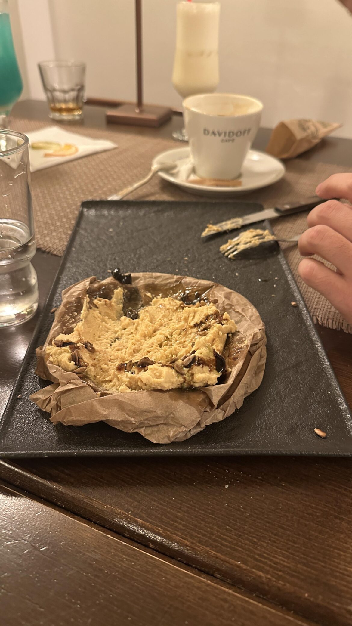 Humus served on wrinkly baking paper
