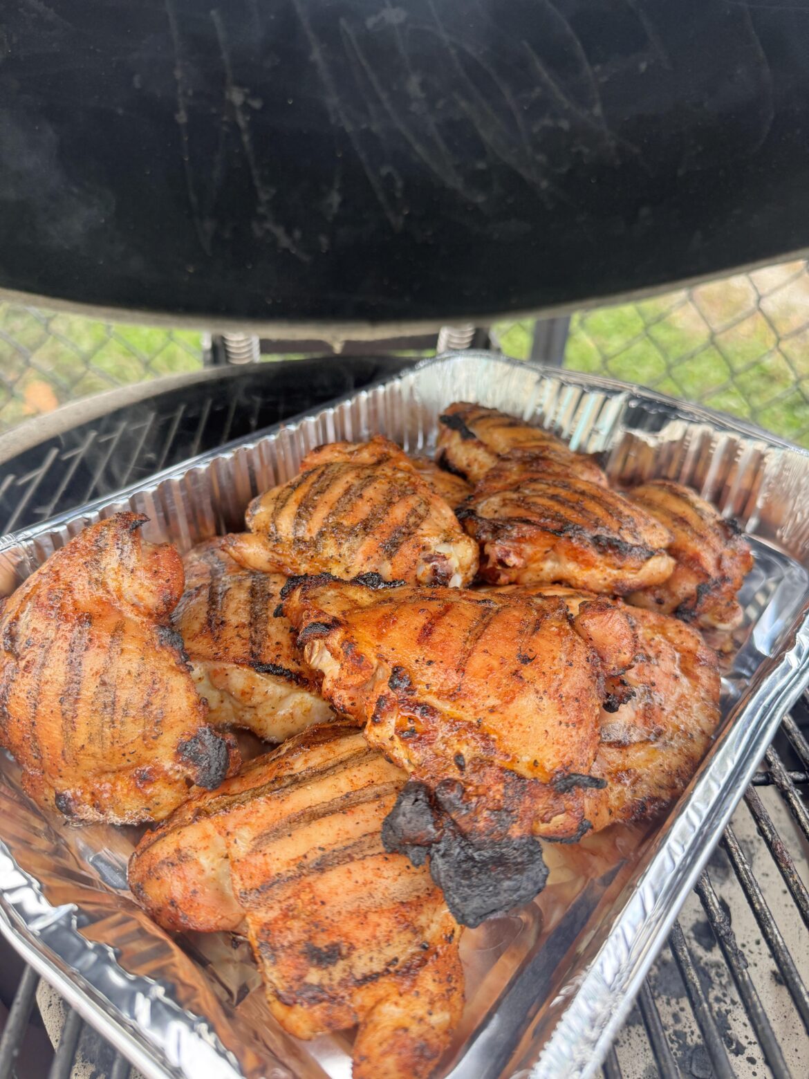 Meal prep on the Kamado! 6 lbs of smoked chicken thighs.