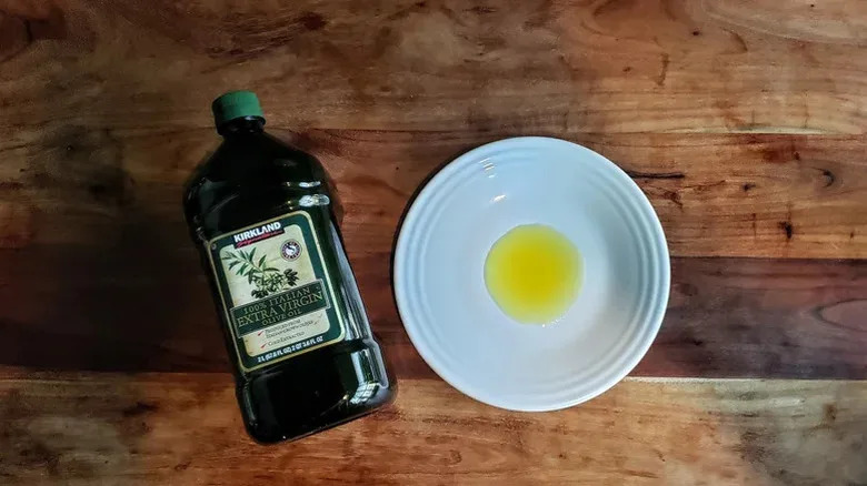 Italian olive oil from Kirkland on a table with a plate