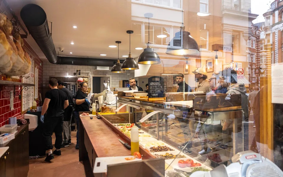 Food counter inside of All'Antico Vinaio, a sandwich shop in Soho