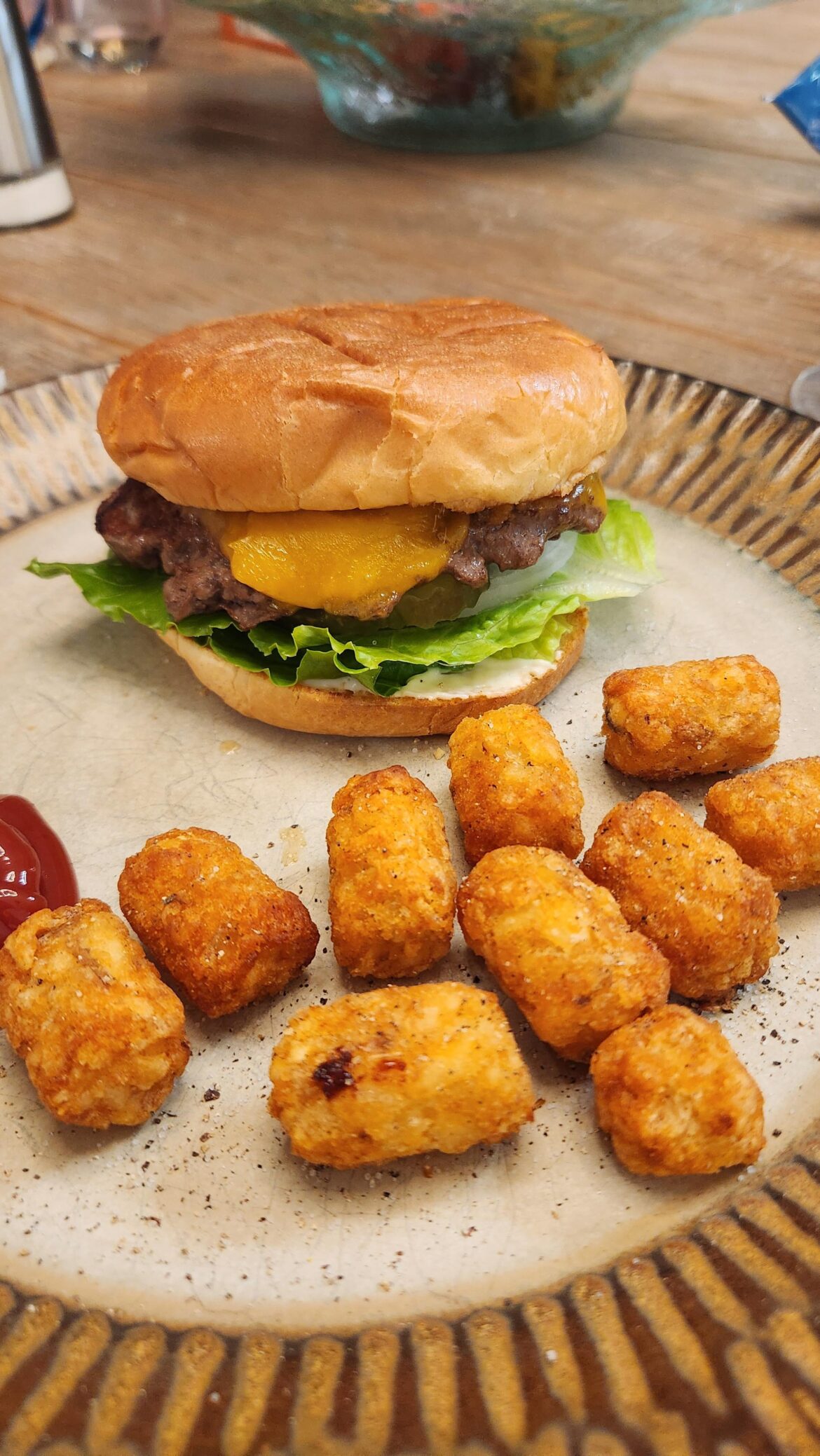 A simple homemade cheeseburger and tots