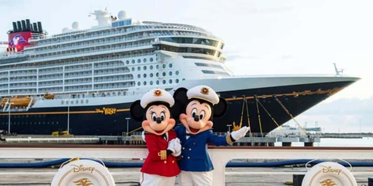 Mickey and Minnie in front of a Disney Cruise Line ship