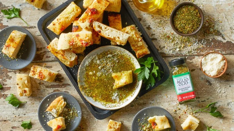 Trader Joe's aglio olio seasoning mixed with olive oil and served with crusty bread