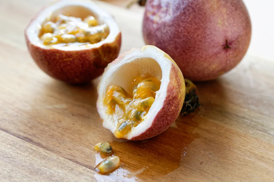 Sliced passion fruit on a cutting board