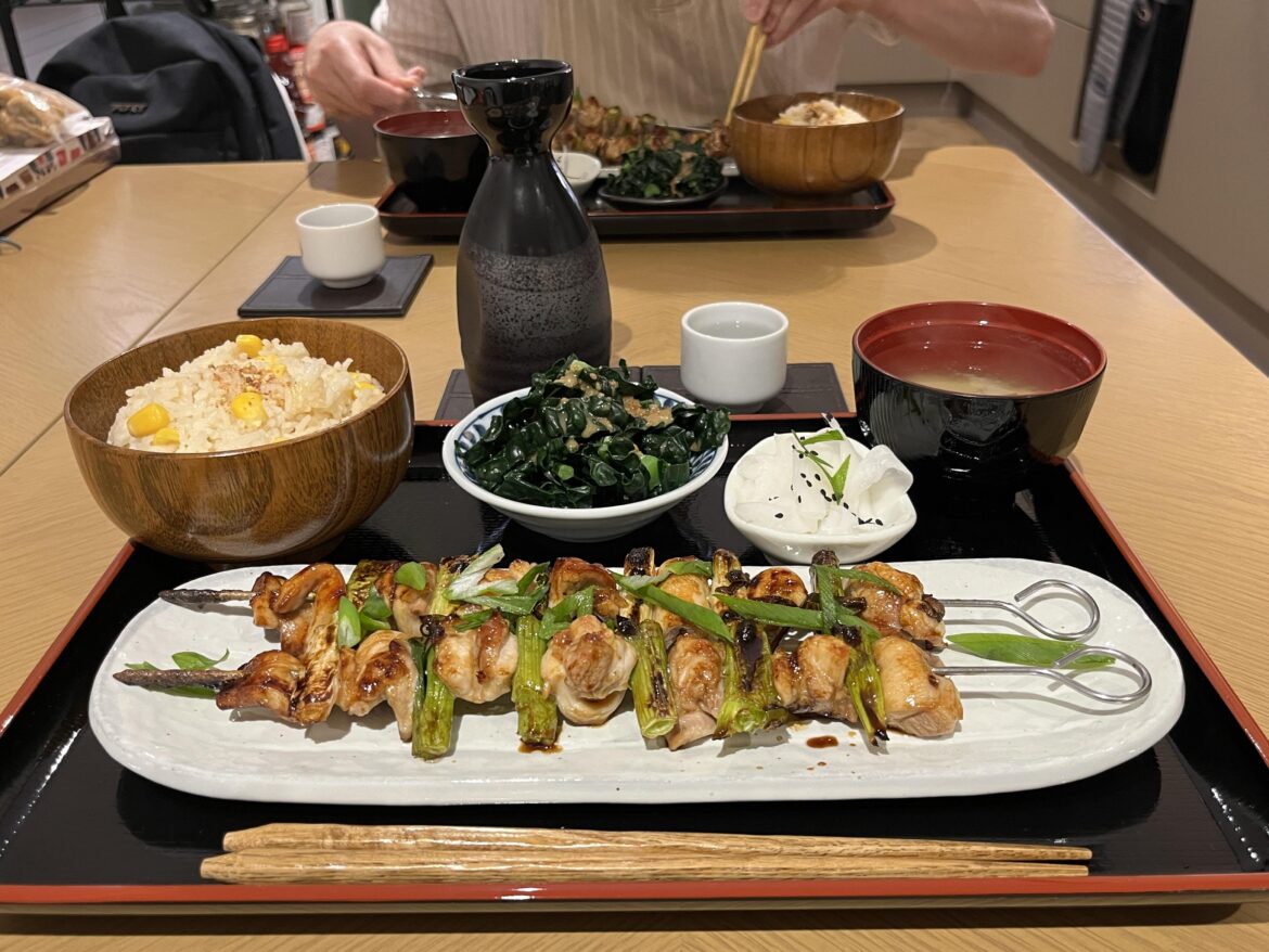 Homemade Yakitori, miso soup, pickled daikon, sweetcorn rice, goma-ae greens, with yuzu sake