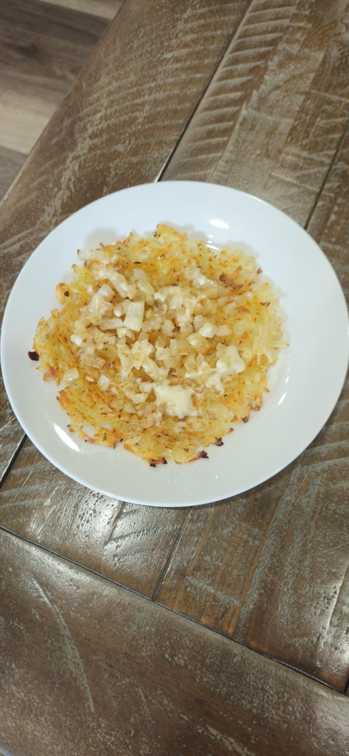 Homemade Hashbrowns with grilled onions and cheese.