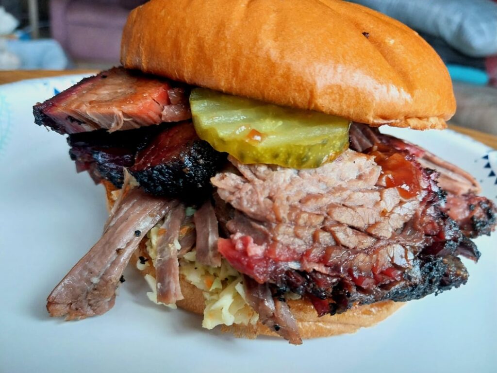 Brisket sandwich from Oak Smoke in Onaway, MI. 8ncludrs beans, slaw, and a pip for $14 cash.