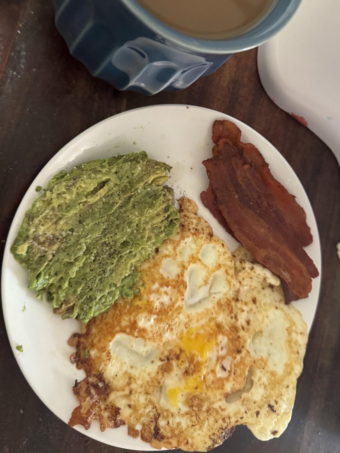 Eggs, bacon, avocado with a French roast coffee