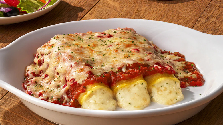 Four-cheese manicotti plated in a white dish