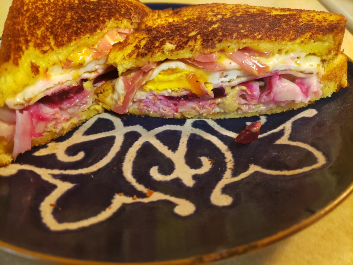 Potato bread, Dijon mustard, turkey, pickled beets, runny egg, white American cheese, pickled onions, everything aoili.