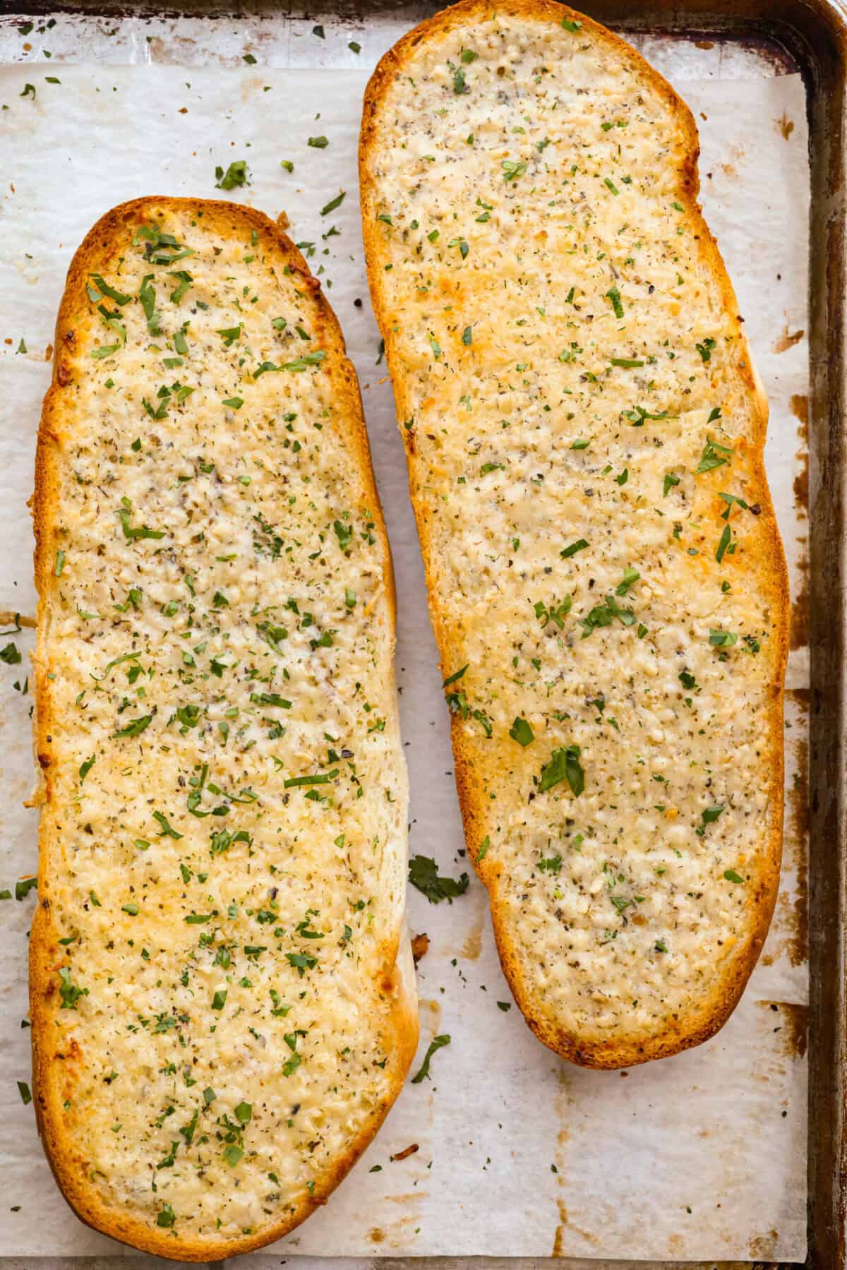 I’m not saying I’ve eaten half a loaf of this Garlic Bread straight off the baking sheet…but I’m also not not saying that. It’s golden, cheesy, dripping with garlicky butter, and so good! Perfectly browned garlic bread.