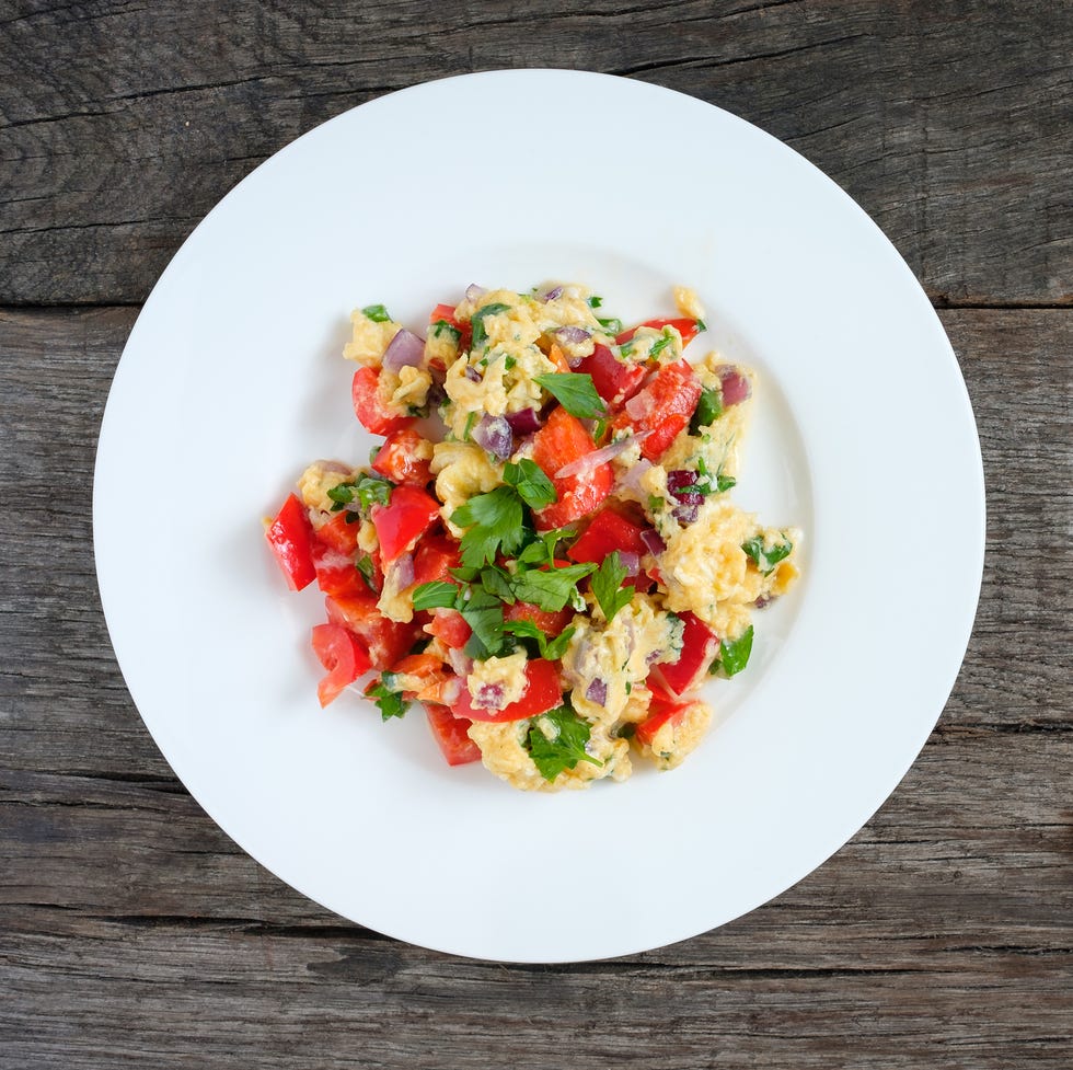 Scrambled eggs with onions, pepper and parsley