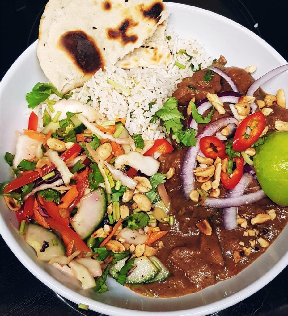 From Scratch Pork Penang Curry (HOT), Lime Coconut Rice, Peanut Salad/ Slaw and Flatbreads. Ugly Delicious.