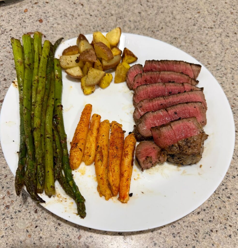Last night’s dinner, prime filet, real crab legs, air fried garlic potatoes, and asparagus